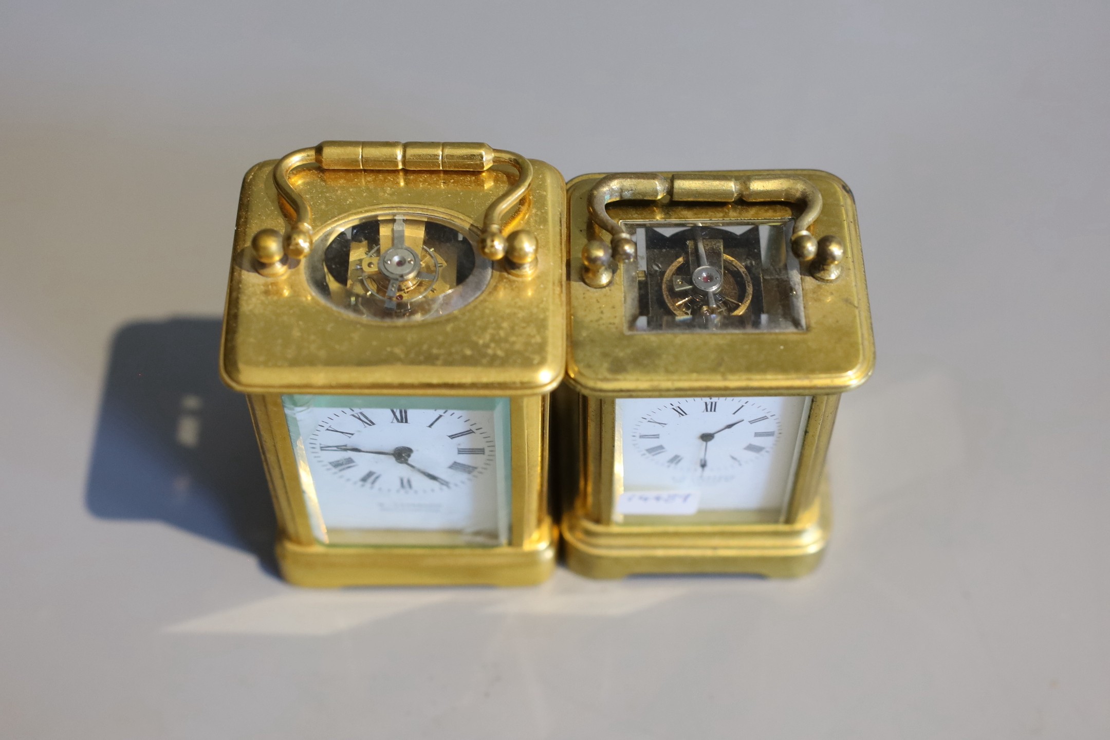 Two late 19th / early 20th century French lacquered brass miniature carriage timepieces, tallest 7cm